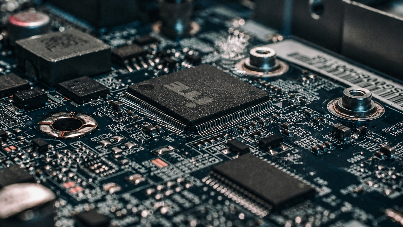 Macro view of a circuit board centered on an integrated circuit and surrounding components.