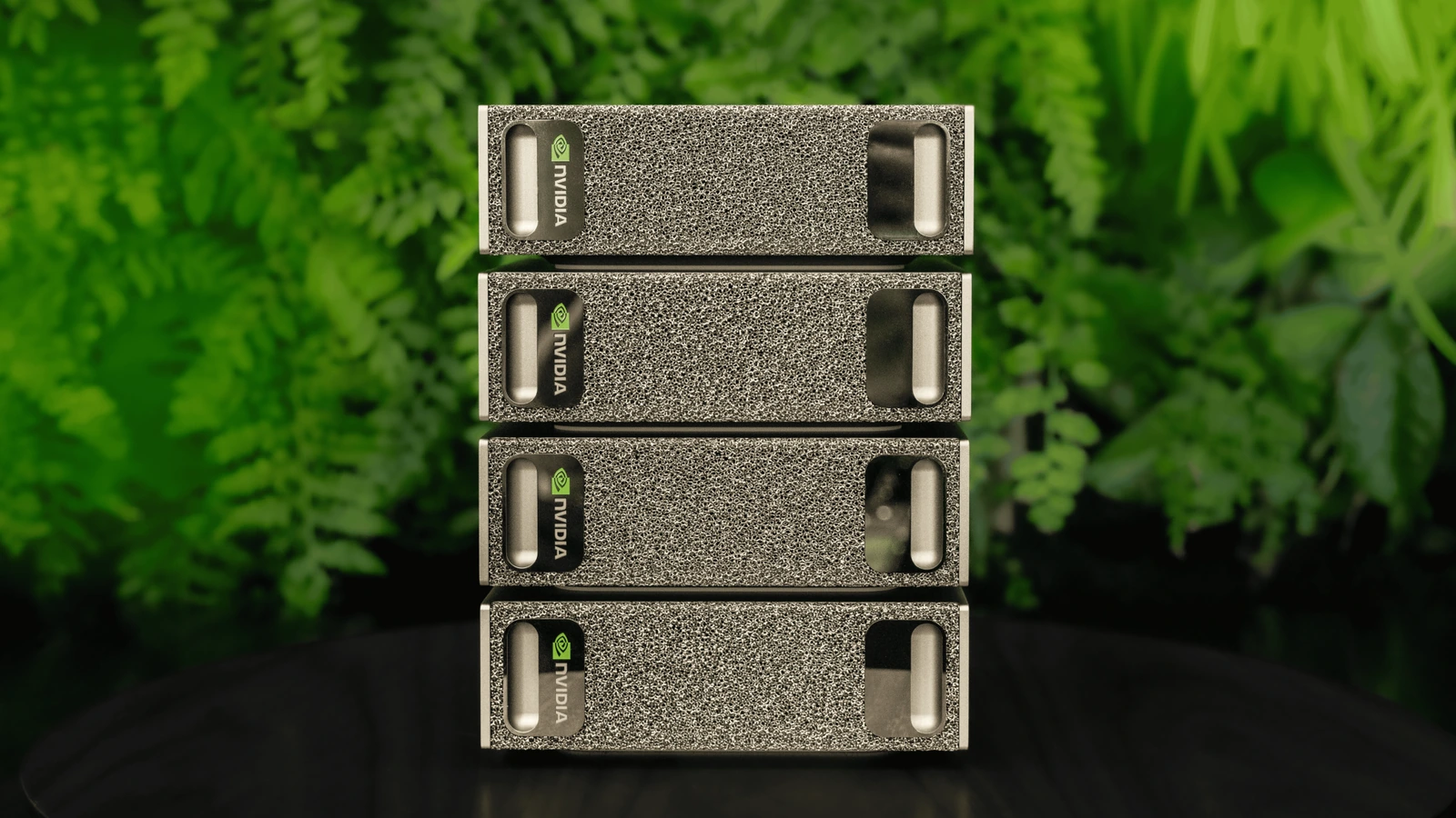 Four NVIDIA DGX Spark systems stacked in an NVIDIA product photograph.