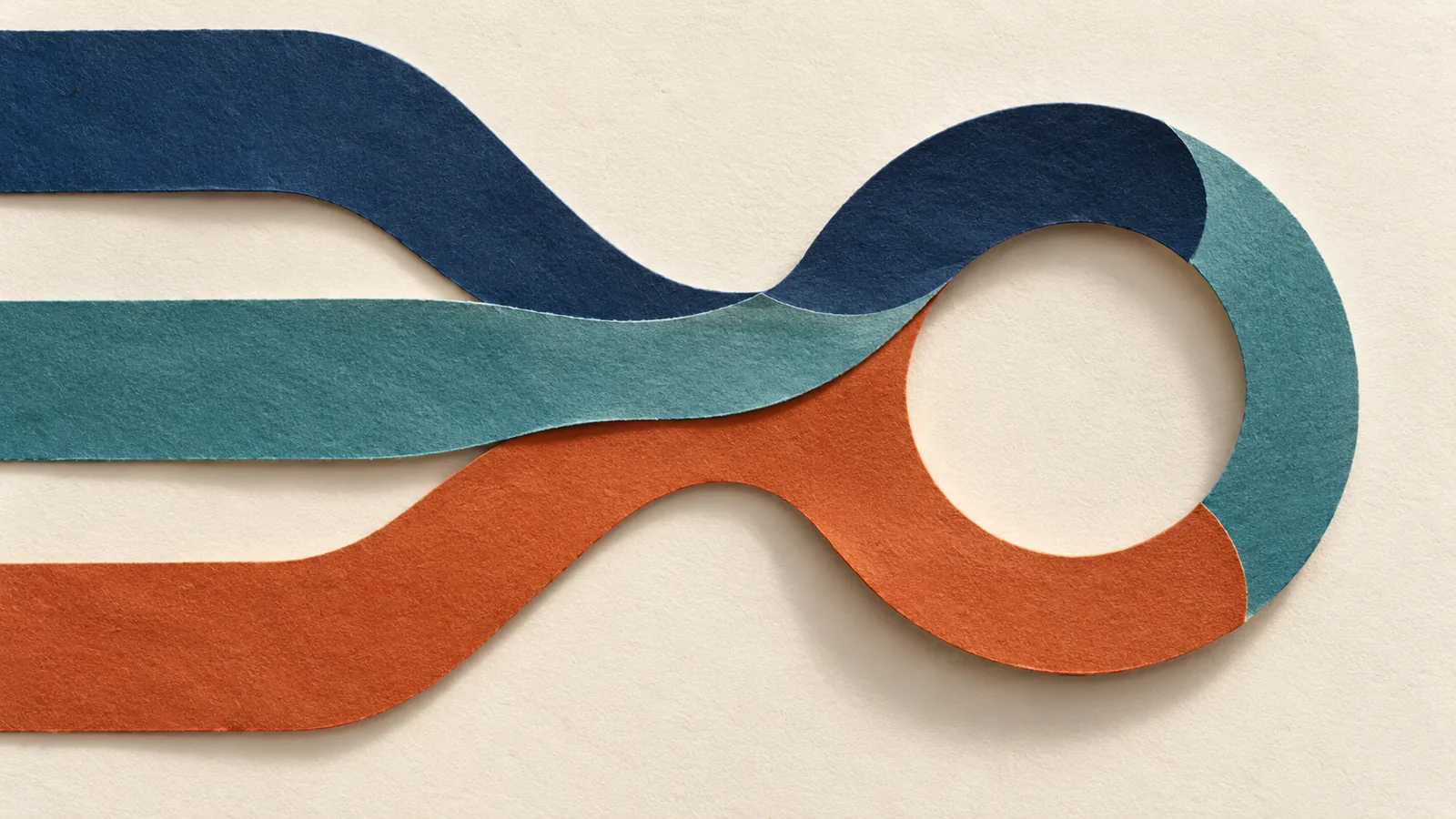 Navy, teal and rust paper paths converge into one loop on ivory paper.